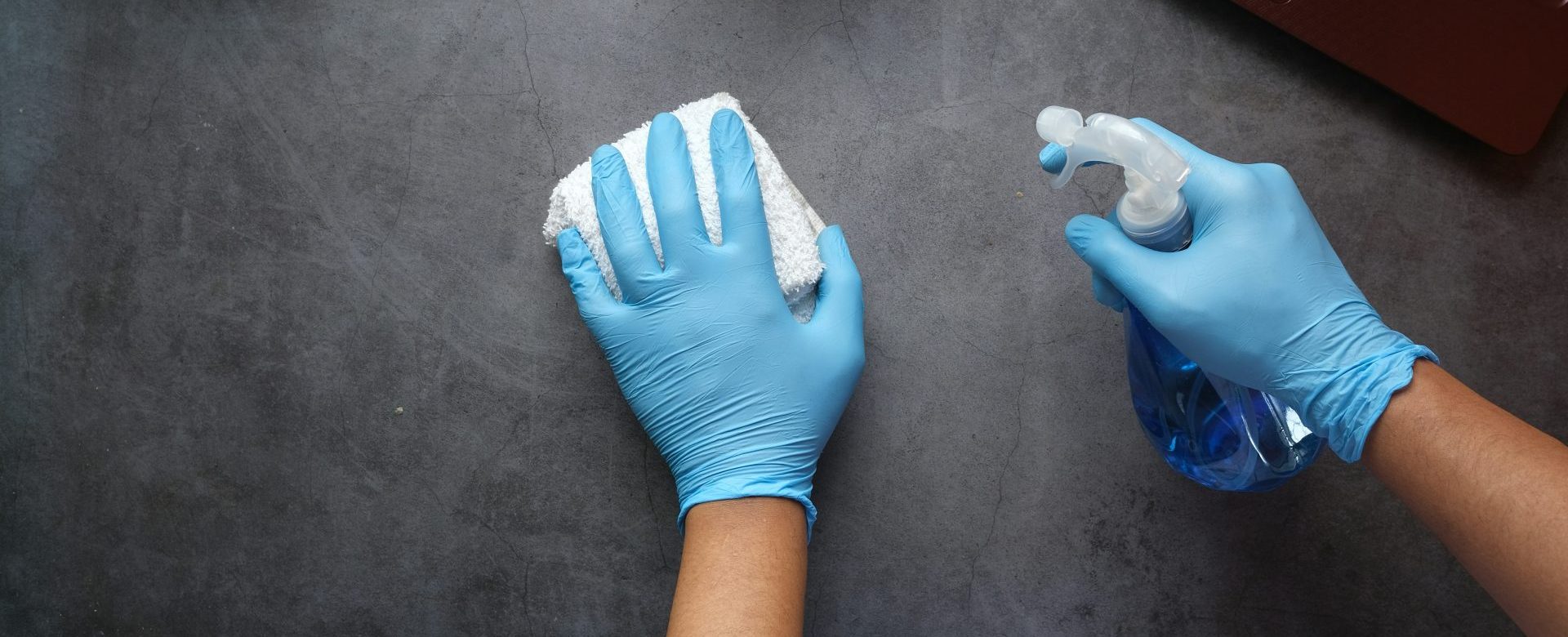 person in blue long sleeve shirt sitting beside black laptop computer